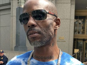 Rapper DMX, whose given name is Earl Simmons, was sentenced Wednesday to a year in prison in his tax evasion case.