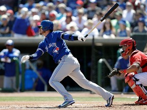 In this March 16, 2018, file photo, Toronto Blue Jays' Josh Donaldson singles off Philadelphia Phillies starting pitcher Vince Velasquez during the first inning of a spring training baseball game in Clearwater, Fla. (AP Photo/Chris O'Meara, File)