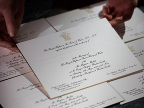 Invitations for Prince Harry and Meghan Markle's wedding in May, after they have been printed at the workshop of Barnard and Westwood in London Thursday March 22, 2018. Prince Harry and Meghan will get married at St George's Chapel in Windsor Castle on Saturday May 19. (Victoria Jones/Pool via AP)
