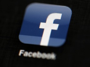 In this May 16, 2012, file photo, the Facebook logo is displayed on an iPad in Philadelphia.