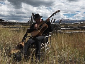 Neil Young as the Man in the Black Hat is shown in the film "Paradox" in this undated handout photo. Beneath all the whimsy in Neil Young's trippy new dystopian Western "Paradox" lies a serious message about a "crisis" facing the music industry, says the Canadian rock great. Actress Daryl Hannah wrote and directed the surreal Netflix film, in which prospectors looking for old technology jam on guitars and ruminate on the importance of music and "the seeds of life" in the Rocky Mountains. Young plays the mysterious Man in the Black Hat alongside a cast that includes Willie Nelson and his sons Lukas Nelson and Micah Nelson from the band Promise of the Real.