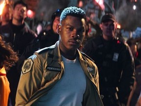 This image released by Universal Pictures shows, foreground from left, Cailee Spaeny, John Boyega and Scott Eastwood in a scene from "Pacific Rim Uprising." (Legendary Pictures/Universal Pictures via AP) ORG XMIT: NYET601