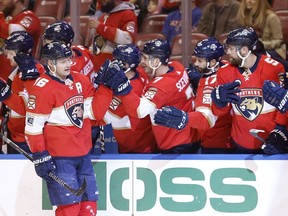 Florida Panthers center Aleksander Barkov (16) is congratulated by teammates after scoring during the first period of an NHL hockey game against the Philadelphia Flyers, Sunday, March 4, 2018, in Sunrise, Fla.