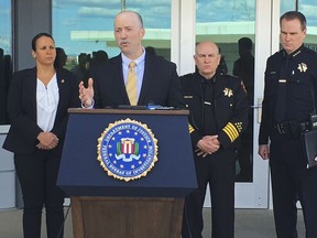 Sean Ragan, FBI special agent in charge, briefs reporters about a crash at the main gate of Travis Air Force Base, Calif., Friday, March 23, 2018.