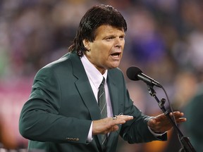 In this Oct. 8, 2012, file photo, former New York Jets defensive end Mark Gastineau speaks during halftime of a game between the Jets and the Houston Texans in East Rutherford, N.J. (AP Photo/Julio Cortez, File)