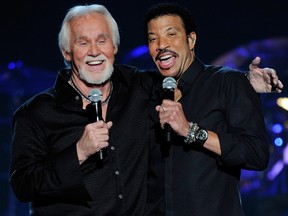 Singer-songwriters Kenny Rogers (L) and Lionel Richie perform during Lionel Richie and Friends in Concert presented by ACM at the MGM Grand Garden Arena April 2, 2012 in Las Vegas, Nevada. (Photo by Ethan Miller/Getty Images)