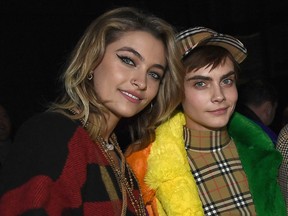 Paris Jackson and Cara Delevingne wearing Burberry at the Burberry February 2018 show during London Fashion Week at Dimco Buildings on February 17, 2018 in London, England.  (Photo by Gareth Cattermole/Getty Images for Burberry)