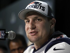 In this Feb. 4, 2018, file photo, New England Patriots tight end Rob Gronkowski answers questions during a news conference ahead of the Super Bowl, in Minneapolis. (AP Photo/Mark Humphrey, File)