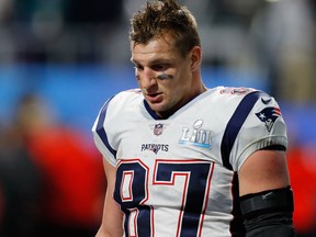 Rob Gronkowski of the New England Patriots walks off the field after his team's loss to the Philadelphia Eagles in Super Bowl LII at U.S. Bank Stadium on Feb. 4, 2018