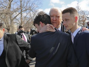 Sen. Orrin Hatch, R-Utah, centre, hugs Kyle Kashuv, 16, and Patrick Petty, 17, both from Parkland, Fla., following a news conference on Capitol Hill in Washington, Tuesday, March 13, 2018. (Pablo Martinez Monsivais/AP Photo)
