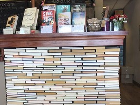 This undated photo shows the check-out counter at the indie bookseller Newtonville Books in Newton, Mass. The counter is made of rows of backwards books glued into place.