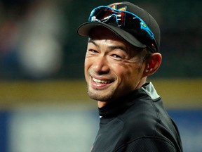 In this April 17, 2017, file photo, Miami Marlins' Ichiro Suzuki smiles to fans as he takes the field during batting practice before a baseball game against his former team, the Seattle Mariners, in Seattle