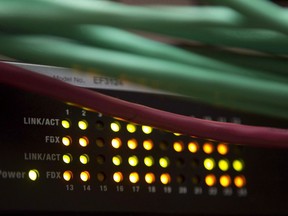 Lights on an internet switch are lit up in an office in Ottawa, on Feb. 10, 2011. Two of Canada's biggest internet service providers are preparing to increase their subscriber prices.