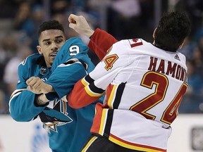 San Jose Sharks' Evander Kane fights with Travis Hamonic during the third period of an NHL hockey game Saturday, March 24, 2018, in San Jose, Calif. (AP Photo/Marcio Jose Sanchez)