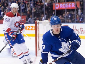 Toronto Maple Leafs' Kasperi Kapanen (right) turns after scoring his team's second goal as Montreal Canadiens defenseman Noah Juulsen looks on during second period NHL hockey action in Toronto on Saturday, March 17, 2018.THE CANADIAN PRESS/Chris Young
