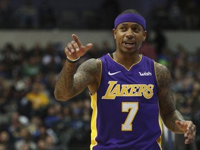 In this Feb. 10, 2018, file photo, Los Angeles Lakers guard Isaiah Thomas (7) gestures during a game against the Dallas Mavericks in Dallas.