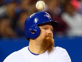 Adam Lind of the Toronto Blue Jays fouls a ball against the Cleveland Indians during MLB action in Toronto on May 13, 2014