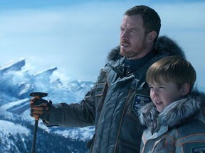 Toby Stephens, left, and Maxwell Jenkins star in Netflix's "Lost in Space." (Netflix)