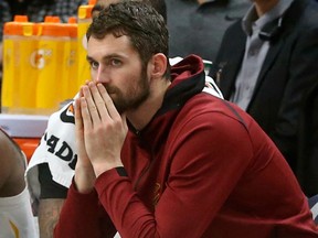 In this Jan. 8, 2018, file photo, Cleveland Cavaliers' Kevin Love watches from the bench in the second half of an NBA basketball game against the Minnesota Timberwolves in Minneapolis
