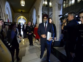 Minister of National Defence Minister Harjit Sajjan, Minister of Foreign Affairs Chrystia Freeland and Chief of Defence Staff Jonathan Vance leave after holding a press conference on Canada's peacekeeping mission to Mali in the foyer of the House of Commons on Parliament Hill in Ottawa Monday, March 19, 2018.
