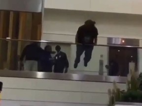 A video circulating on social media shows a man leaping over a railing at an Atlanta Airport. (Twitter/Jerz_Boy_Virgo)