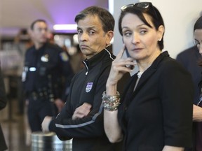 Sacramento Kings owner Vivek Ranadive watches as protesters block the entrance to the Golden One Center preventing fans from entering the arena to watch the Sacramento Kings take on the Dallas Mavericks in Sacramento, Calif., Tuesday, March 27, 2018.