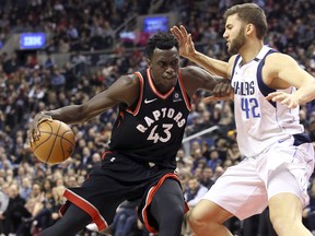 Toronto Raptors forward Pascal Siakam (43) is defended by Dallas Mavericks forward Maximilian Kleber (42) in Toronto Friday March 16, 2018. (Veronica Henri/Toronto Sun)