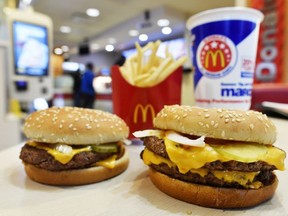 A McDonald's Quarter Pounder, left, and Double Quarter Pound burger are shown with fresh beef Tuesday, March 6, 2018, in Atlanta. McDonald's is offering fresh beef rather than frozen patties in some burgers at thousands of restaurants, a switch it first announced about a year ago as it works to appeal to customers who want fresher foods.
