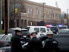 Deputies and federal agents converge on Great Mills High School, the scene of a shooting, Tuesday morning, March 20, 2018 in Great Mills, Md.