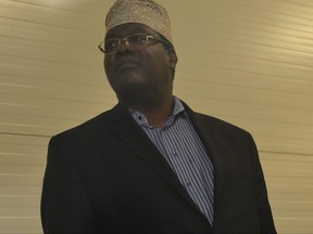 Kenyan-born Canadian lawyer and self-declared National Resistance Movement General, Miguna Miguna, listens to journalists' questions at the Jomo Kenyatta International Airport on Monday, March 26, 2018, in Nairobi.
