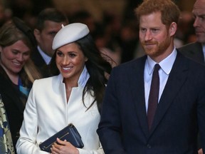 Prince Harry (R) and his fiancee, actress Meghan Markle (C) leave after attending a Commonwealth Day Service at Westminster Abbey in central London, on March 12, 2018. (DANIEL LEAL-OLIVAS/AFP/Getty Images)