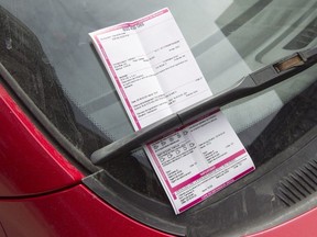 A parking ticket is seen on a windshield Friday, March 23, 2018 in Montreal.