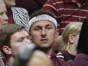 Former Texas A&M quarterback Johnny Manziel watches the second half of an NCAA men's college basketball tournament regional semifinal between Michigan and Texas A&M on Thursday, March 22, 2018, in Los Angeles. (AP Photo/Jae Hong)