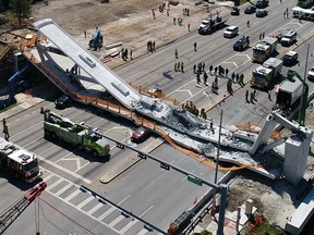 This photo provided by DroneBase shows the collapsed pedestrian bridge at Florida International University in the Miami area on Thursday, March 15, 2018. (DroneBase via AP)