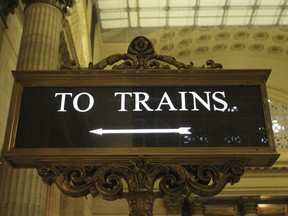 In this Nov. 12, 2017 photos, the "To Trains" sign in the Great Hall of Chicago Union Station directs passengers to loading platforms.