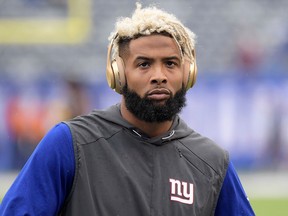 This Oct. 8, 2017, file photo shows New York Giants wide receiver Odell Beckham Jr. warming up prior to an NFL football game against the Los Angeles Chargers in East Rutherford, N.J. (AP Photo/Bill Kostroun, File)