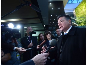 Ontario's Liberal government is breaking its promise to maintain a balanced budget this year, saying its upcoming fiscal plan will run a deficit in order to fund programs for seniors, women and students ahead of a spring election. Ontario Finance Minister Charles Sousa speaks to members of the media as he arrives for meetings with other provincial and territorial ministers and the federal Finance Minister Bill Morneau on Parliament Hill, in Ottawa on Monday, Dec. 11, 2017.