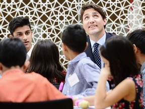 Prime Minister Justin Trudeau meets with children working on small robotics in Toronto on Wednesday, March 21, 2018.