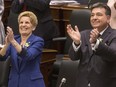 Ontario's Premier Kathleen Wynne and Provincial Finance Minister Charles Sousa applaud as the Ontario Provincial Government delivers its 2018 Budget at the Queens Park Legislature in Toronto, on Wednesday March 28, 2018. THE CANADIAN PRESS/Chris Young
