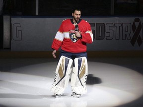 Florida Panthers goaltender Roberto Luongo talks to fans about the shooting at Marjory Stoneman Douglas High School, prior to a game against the Washington Capitals, Thursday, Feb. 22, 2018, in Sunrise, Fla. (THE CANADIAN PRESS/AP/Joel Auerbach)