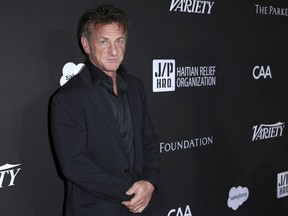 FILE - In this Jan. 6, 2018, file photo, Sean Penn arrives at the 2018 Sean Penn J/P Haitian Relief Organization Gala at Milk Studios in Los Angeles. The actor during an appearance to promote his book on "The Late Show with Stephen Colbert" told the host Monday, March 26, he had taken a sedative "to get to sleep after a red-eye flight" and Penn lit a cigarette. The two-time Academy Award winner described his novel, "Bob Honey Who Just Do Stuff," as "the conversation once a year with the drunken uncle."