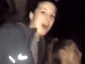 A screen shot from a video showing Virginia Tech's women's lacrosse team singing on a bus