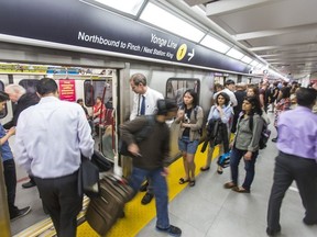 TTC subway riders exit a train on the new 2nd subway platform at Union Station after the TTC in Toronto, Ont. on Thursday July 2, 2015.