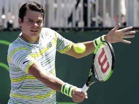 Milos Raonic returns to Mikael Ymer during the Miami Open, Friday, March 23, 2018, in Key Biscayne, Fla. (AP Photo/Lynne Sladky)