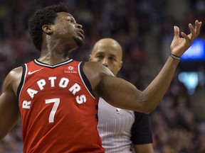 Toronto Raptors guard Kyle Lowry (left) has a discussion with NBA official Marc Davis after fouling out in a loss to the Oklahoma City Thunder in Toronto on Sunday, March 18, 2018. (THE CANADIAN PRESS/Chris Young)