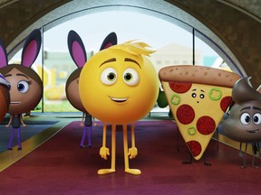 This file image released by Sony Pictures shows Gene, voiced by T.J. Miller, center, in Columbia Pictures and Sony Pictures Animation's "The Emoji Movie."