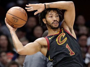 In this Jan. 20, 2018, file photo, Cleveland Cavaliers' Derrick Rose passes during the second half of an NBA basketball game against the against the Oklahoma City Thunder in Cleveland
