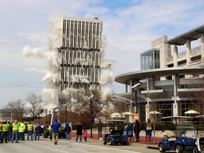 The 28-story Capital Plaza Tower falls during a controlled demolition in Frankfort, Ky., on Sunday, March 11, 2018. Built in 1972, the former state government office building was demolished to make way for a new five-story building and parking garage.