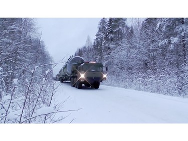 In this video grab provided by RU-RTR Russian television via AP television on Thursday, March 1, 2018, a truck carrying Russia's new Sarmat intercontinental ballistic missile drives through a forest at an undisclosed location in Russia.