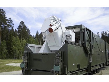 In this video grab provided by RU-RTR Russian television via AP television on Thursday, March 1, 2018, a Russian military truck with a laser weapon mounted on it is shown at an undisclosed location in Russia.